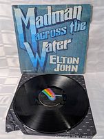 Front cover shown with vinyl disc on MCA logo inner sleeve