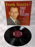 Front cover of Frank Sinatra That Old Feeling album with vinyl displayed