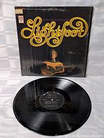 Front cover with shrink and vinyl record displayed