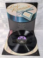 Record on inner sleeve and gatefold showing vinyl condition and label