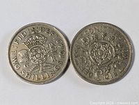 Both two-shilling coins side by side
