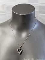 Necklace and pendant on display bust showing drape and overall look