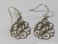 Front view of both earrings showing filigree design and hooks
