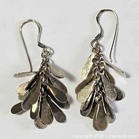Full view of both sterling silver dangle earrings