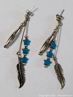 Full view of both earrings showing overall design and components