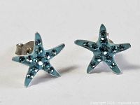 Front view of both starfish earrings showing enamel and rhinestone detailing