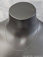 Full view of sterling silver snake chain on bust form