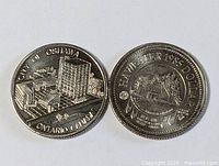 Obverse faces of both commemorative coins