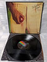 Record removed from inner sleeve showing vinyl condition and label, outer sleeve displayed
