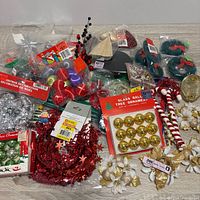 Overview of assorted ornaments, garland, picks and wreaths