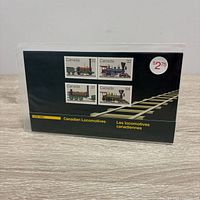 Front of souvenir sheet showing four stamps and bilingual title