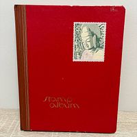 Front cover of red stamp album
