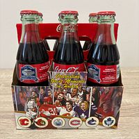Front view showing hockey graphics, bottle fronts, and team logos