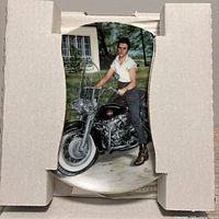Plate in packaging showing Elvis Presley with motorcycle