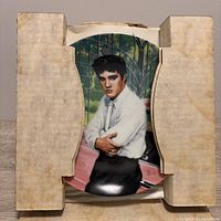 Front view of Elvis Presley porcelain plate secured in internal cardboard frame