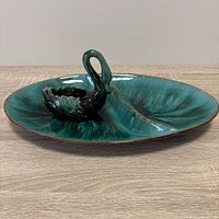 Divided platter with swan bowl placed on top