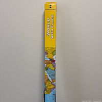 Front of boxed map tube showing Hemispheres branding and map detail