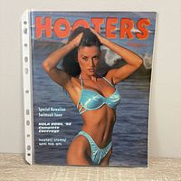 Front cover of Spring 1998 Hooters Magazine in plastic sleeve