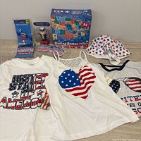 All items laid out showing tops, accessories, puzzle, nutcracker