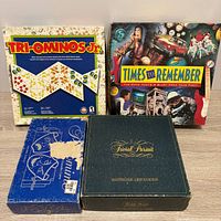 Front view of four game boxes displaying titles and cover art