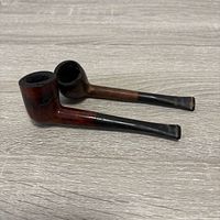 Both pipes side by side showing overall design and wear