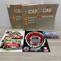 Three Ford 1986 manuals plus two Mosport printed items and Castrol CD
