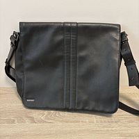 Front view of Mexx black leather messenger bag
