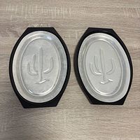 Top view showing both aluminum inserts with cactus design in black bases