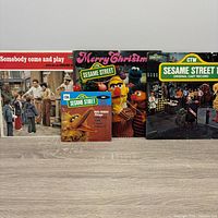 Front covers of three LPs and one 7-inch single