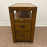 Front view showing full piece, open shelf and two drawers