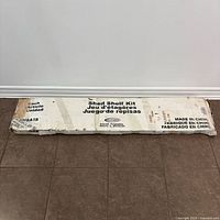 Full view of damaged box labeled Shed Shelf Kit