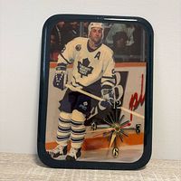 Front view showing player image, dial, hands