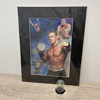 Full view of framed print with figurine in front