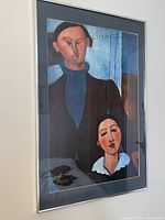 Front view of framed Modigliani reproduction print under glass