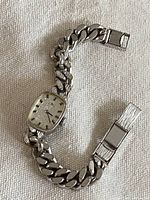 Full view of Bucherer stainless steel wristwatch with curb link bracelet and clasp