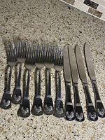 All ten pieces aligned to show full set and rooster design