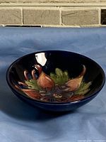 Side view showing bowl form and cobalt glaze