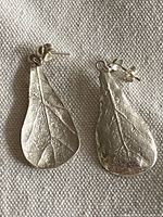 Front view of both sterling silver leaf earrings showing size and design