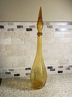 Full view of amber genie bottle decanter with stopper