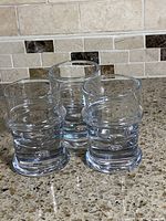 Three Holmegaard Regiment glasses grouped on countertop