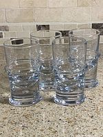 Four highball glasses upright front view