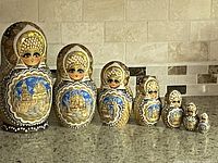 Full lineup of seven nesting dolls from largest to smallest
