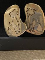 Front view of both earrings showing stamped design