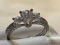 Front view of three-stone sterling silver cubic zirconia ring