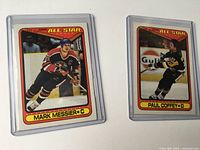 Both sleeved cards side by side