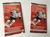 Front view of both sealed packs showing branding and Crosby image