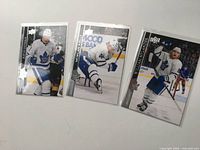 Front view of all three Upper Deck 2020 Maple Leafs cards in sleeves