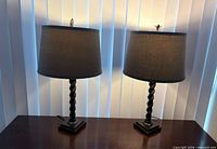 Both barley twist lamps with shades lit off