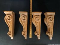 Four oak corbels front view with ruler