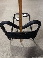 Side perspective illustrating height with ruler against curved handle